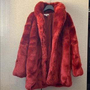 Red faux fur coat